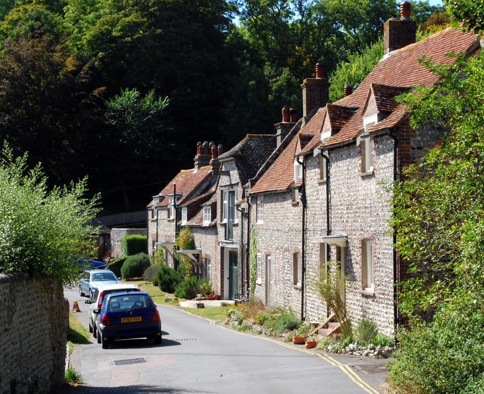 Flint cottages with tiled roofs along a village lane in East Sussex